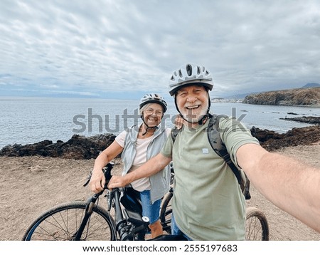 Similar – Image, Stock Photo Hallig Gröde | Senior citizen stands in the calm North Sea at low tide and raises her hands to the sky