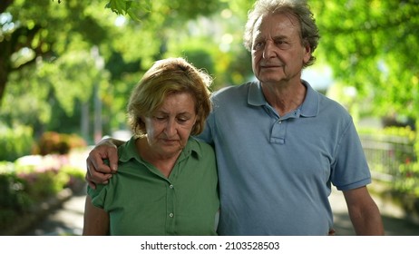 Two Happy Older People Walking Outside Smiling, Senior Couple Together In Outdoor Nature Walk