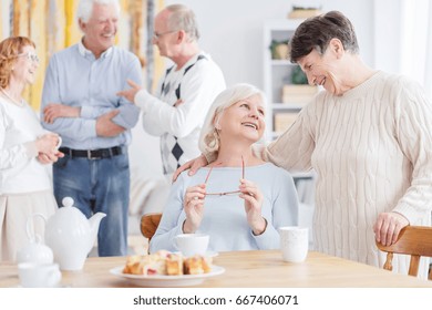 Two happy older women talking about old times - Powered by Shutterstock