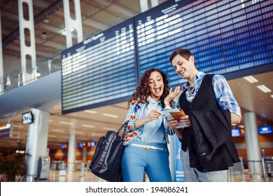 Two Happy People At The Airport 