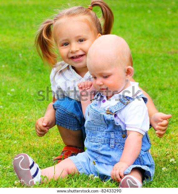 Two Happy Playing Childs On Green Stock Photo 82433290 | Shutterstock