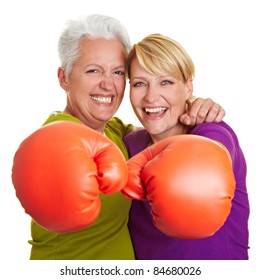 Two Happy Senior Women Boxing With Red Boxing Gloves