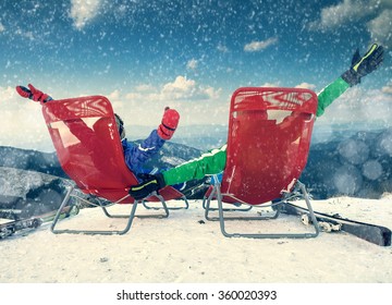 Two Happy Skiers On The Top Of Mountain 