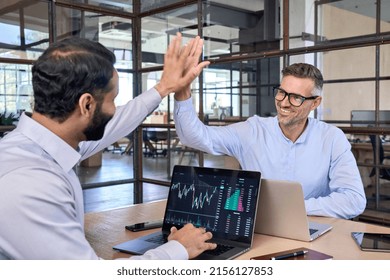 Two happy successful excited diverse traders investors giving high five celebrating successful stock exchange trading deal, rising crypto bull market shares growth, ipo profit victory concept. - Shutterstock ID 2156127853
