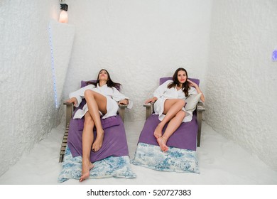 Two Happy Women Relaxing In A SPA Salarium Salt Cave