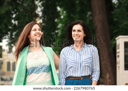 Similar – Image, Stock Photo happy twin sisters stand back to back