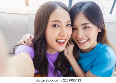 Two Happy Young Women Friends  Looking At Camera Of Smart Phone Making Selfies On Mobile Phone With Happiness And Smile Face Portrait Of Happy Girl Friend Older Sister And Younger Sister Stay At Home