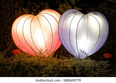 Two heart or love lamp on the park, the colors are red and purple - Powered by Shutterstock