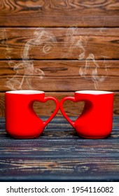 Two Heart Shaped Mugs With Tea