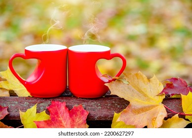 two heart shaped mugs with tea on a Park bench
 - Powered by Shutterstock