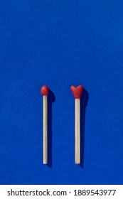 Two Heart Shaped Red Matchsticks Couple, Blue Background. Сoncept Of Perfect Match, Fire Of Love And Passion. The One And Only. Happy Valentines Day. Holiday Romantic Wedding Poster, Greeting Card.