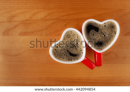 Two heart-shaped coffee cups