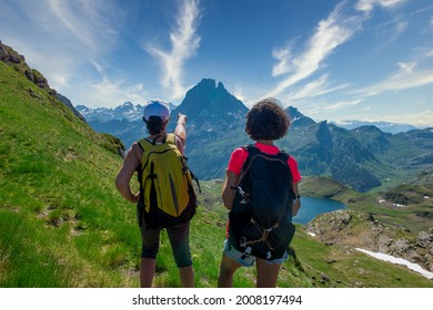 Two Hiker Women In Path Of Pic Du Midi Ossau In The French Pyrenees Mountains