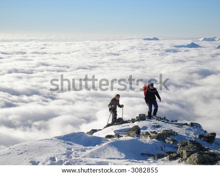Two hikers on top of peak