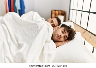 Two hispanic men couple sleeping at bedroom