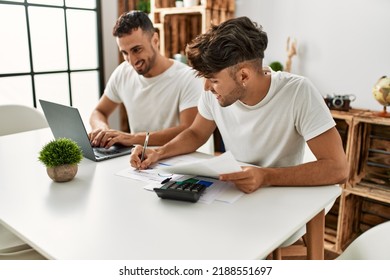 Two Hispanic Men Couple Smiling Confident Using Laptop Working At Home