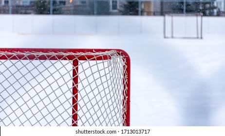 Two hockey nets on an outdoor public rink in Ottawa.