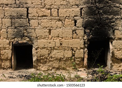 Two Holes Of A Primitive Oven To Make Toasted Cassava Flour With Smoke Signs At The Brick. Construction In Adobe