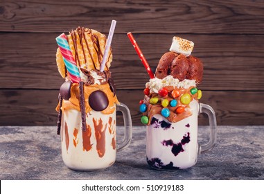 Two homemade extreme milkshakes on table