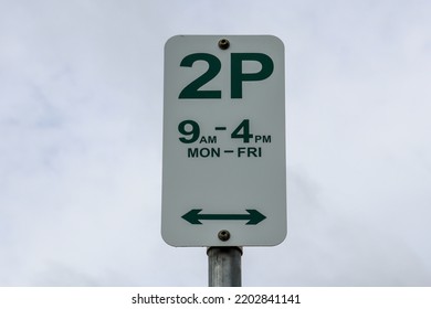 Two Hour Parking Sign Against Sky