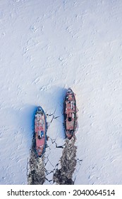 Two Icebreakers Breaking Ice On River In Winter. Aerial View Of Poland In Winter