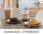 Two iced coffee with two donuts