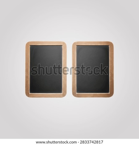 Two identical gold frames with dark gray mats on clean white background... frames,...