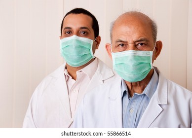 Two Indian / Asian Doctors Or Dentists Wearing Masks