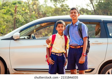 Two Indian Boys Ready To Go To School On The Car