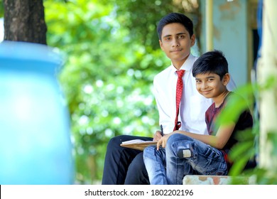 Two Indian Child Studying At Home