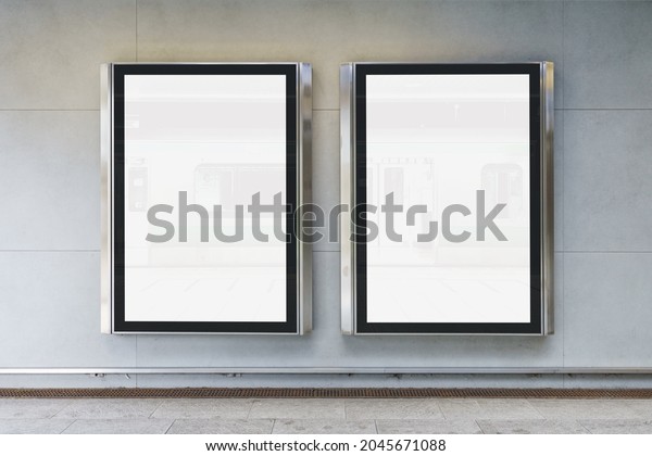 Two indoor
outdoor city light mall shop template. Blank billboard mock up in a
subway station, underground interior. Urban light box inside
advertisement metro airport
vertical.