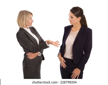 Two isolated businesswoman talking together: concept for body language.