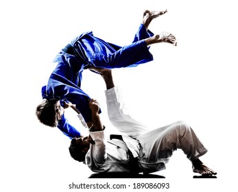 two judokas fighters fighting men in silhouettes on white background