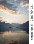 Two kayakers on the beautiful secluded Lake Crescent in the Olympic National Park.