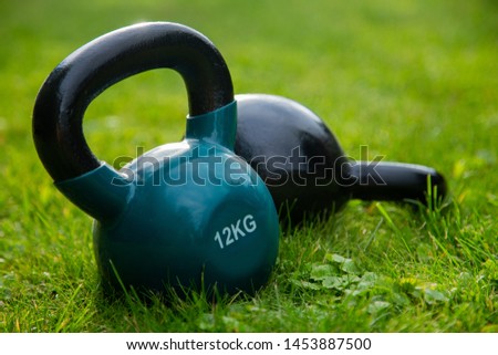 Two kettlebell weights presenting active style of life.