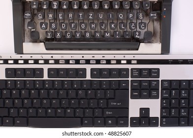 Two keyboards, of old typewriter and computer