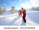 two kid cross-country skiing in the snow-covered winter forest