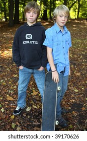 Two Kids Acting Cool With There Skate Board