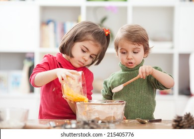 Two Kids Cooking At Home.