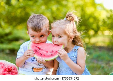 Two kids eating one slice of watermelon in the garden. Kids eat fruit outdoors. Healthy snack for children. 2 years old girl and boy enjoying watermelon. - Powered by Shutterstock