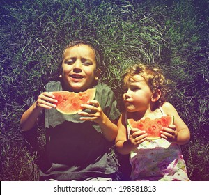 Two Kids Eating Watermelon Done With A Retro Vintage Instagram Filter