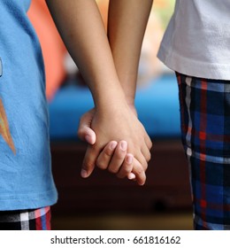 Two Kids Holding Hands