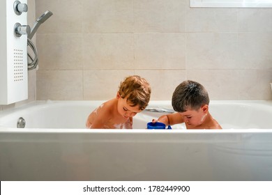 Two Kids Playing In A Bubble Bath