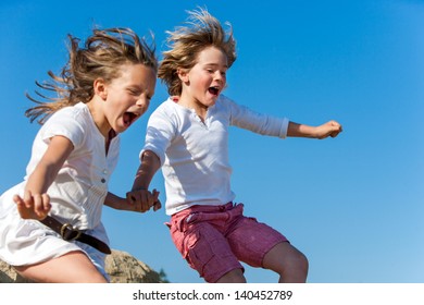 Two Kids Shouting Jumping Together Outdoors Stock Photo 140452789 ...