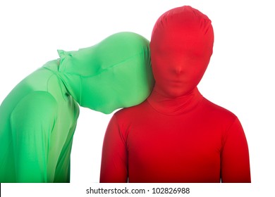 Two Kids Wearing Bright, Colorful Spandex Body Suits.  One Is Red, The Other Is Green.