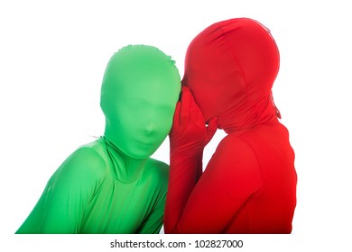 Two Kids Wearing Bright, Colorful Spandex Body Suits.  One Is Red, The Other Is Green.