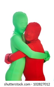 Two Kids Wearing Bright, Colorful Spandex Body Suits.  One Is Red, The Other Is Green.