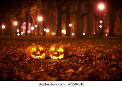 Two Kind Halloween Pumpkins in the park at night - Shutterstock ID 701584510