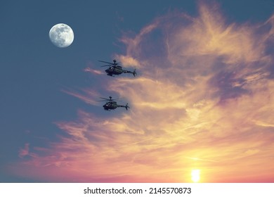 Two Kiowa helicopters in flight  