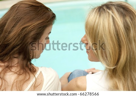 Two ladies near the poolside
